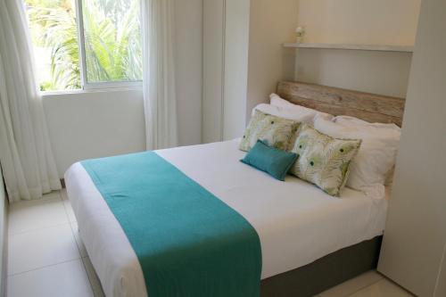 A bed or beds in a room at Pointe d'Esny Beachfront Luxury Apartment