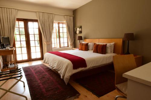 Katil atau katil-katil dalam bilik di Highgrove Guesthouse Sandton