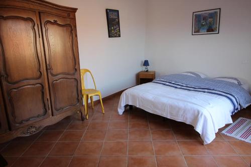 Ένα ή περισσότερα κρεβάτια σε δωμάτιο στο Maison de village Ramatuelle