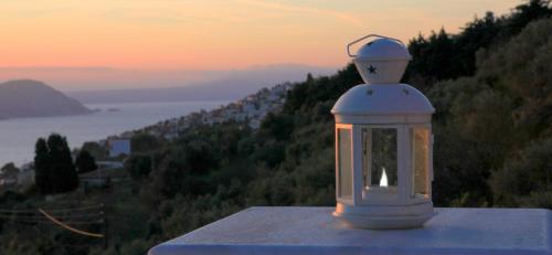 a white lantern sitting on top of a building at Villa Malena in Glóssa