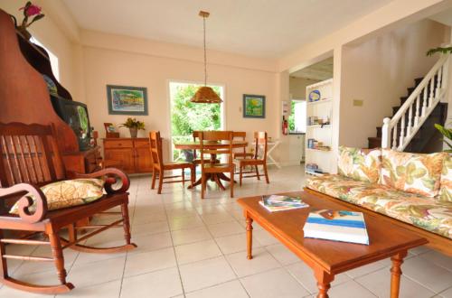 a living room with a couch and a table at Plantation Beach Villas in Black Rock