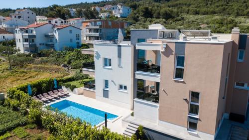 an aerial view of a house with a swimming pool at Villa Piramida in Trogir