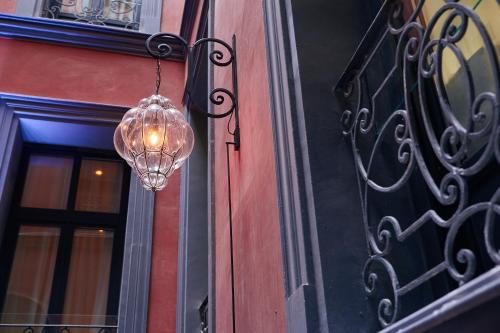 a glass chandelier hanging off the side of a building at CoolRooms Palacio de Atocha in Madrid