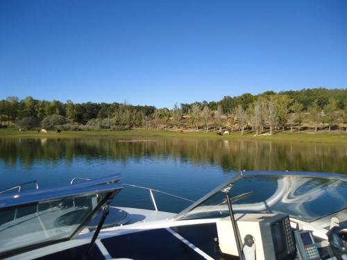 a boat is docked on a body of water at Posada del Indiano in Cidones