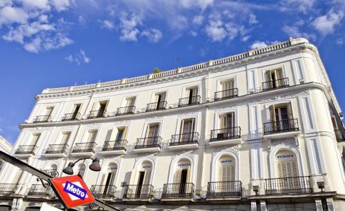 a large white building with balconies on top of it at Hotel Europa in Madrid