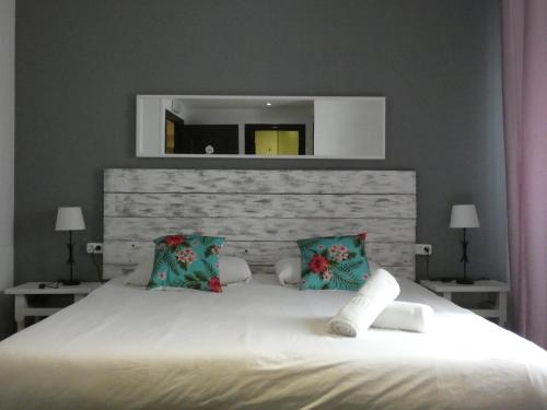 Кровать или кровати в номере Oasis Backpackers' Toledo