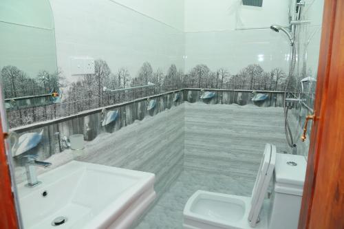 a bathroom with a sink and a toilet at AGP home in Nuwara Eliya