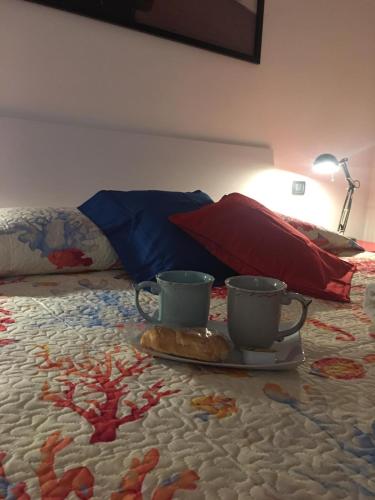 En eller flere senge i et værelse på Triglia