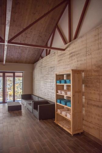 a room with wooden walls and a vaulted ceiling at Apricot Aghveran Resort in Agveran