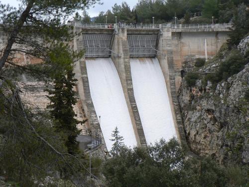 a dam on a mountain with water flowing through it at Apartahotel Al Alba in Pozo Alcón
