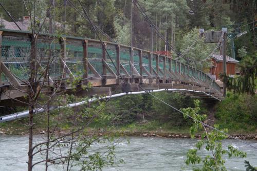 a bridge over a river with a train on it at Panorama Vacation Retreat at Horsethief Lodge in Panorama