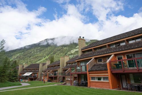 a row of buildings with a mountain in the background at Panorama Vacation Retreat at Horsethief Lodge in Panorama