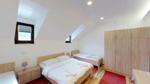 Кровать или кровати в номере Čuček Guesthouse