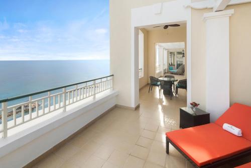 a balcony with a view of the ocean at Jewel Grande Montego Bay Resort and Spa in Montego Bay