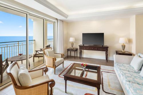 a living room with a view of the ocean at Jewel Grande Montego Bay Resort and Spa in Montego Bay