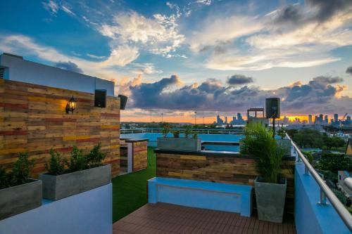 a rooftop patio with a view of the city at Hotel Buenos Aires in Cartagena de Indias