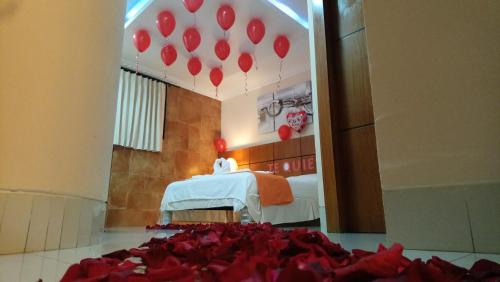 Postel nebo postele na pokoji v ubytování Hotel Murali - Cerca del Aeropuerto de Guayaquil