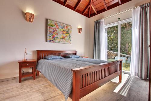 Tempat tidur dalam kamar di Villa Javier La Palma
