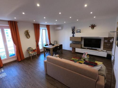 a living room with a couch and a table at Rigoletto Massena in Nice