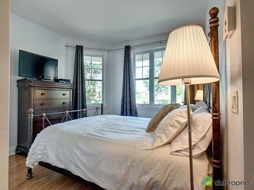 Cama ou camas em um quarto em Condo Le Champlain - 105