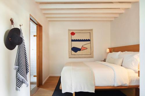 Un ou plusieurs lits dans un hébergement de l'établissement Hotel Joaquin