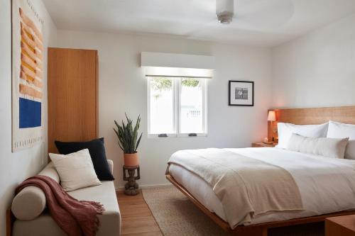Un ou plusieurs lits dans un hébergement de l'établissement Hotel Joaquin