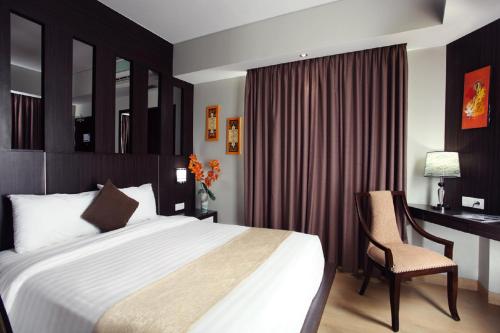 Postel nebo postele na pokoji v ubytování Grand Hatika Hotel