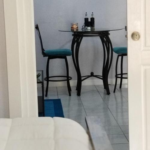 a dining room table with two chairs and a table at Millsborough B&B in Billy Dun