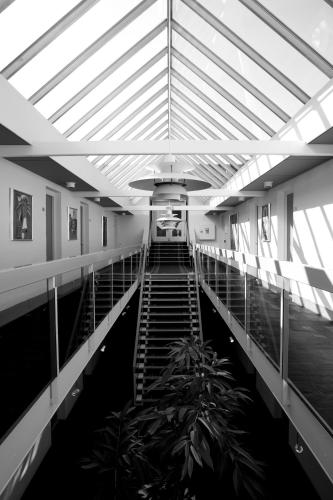 a hallway with stairs in a building at Nilles Kro in Sabro
