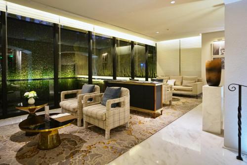 Metropolo Dahua Hotel Shanghaiにあるシーティングエリア
