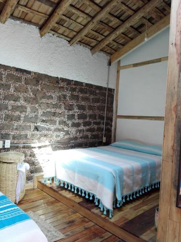 Postel nebo postele na pokoji v ubytování Casa del siglo XVII