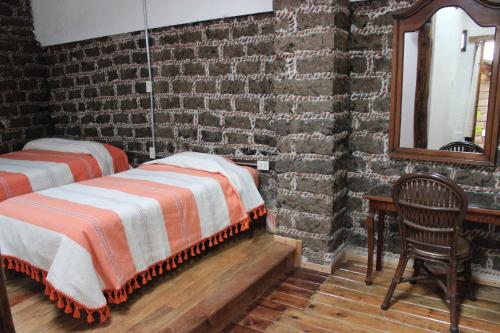 Postel nebo postele na pokoji v ubytování Casa del siglo XVII