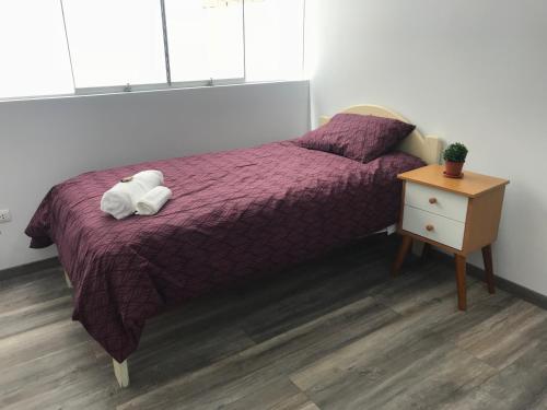 Ένα ή περισσότερα κρεβάτια σε δωμάτιο στο Cuzco Apartment