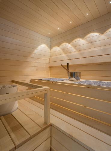 a sauna with wooden walls and wooden floors at Original Sokos Hotel Presidentti Helsinki in Helsinki