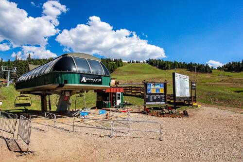 a building with a dome on top of a hill at Snowfire 307A in Angel Fire