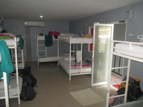 a dorm room with several bunk beds in it at Blanco Beach Bar Hostel in Phi Phi Don