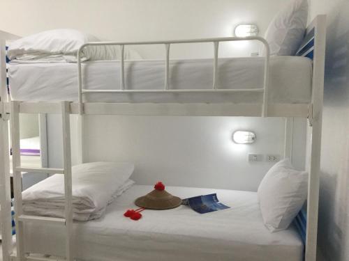 Postel nebo postele na pokoji v ubytování SABUN-NGA HOSTEL
