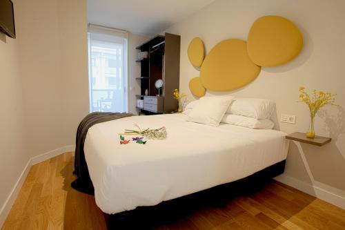 En eller flere senge i et værelse på Smart Urban Orio