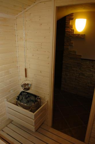 a sauna with a bowl of rocks in it at Pension & restaurace Zelený Mlýn Žacléř in Žacléř