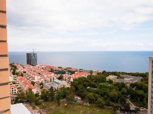 an aerial view of a city and the ocean at ArcadiaSky in Odesa