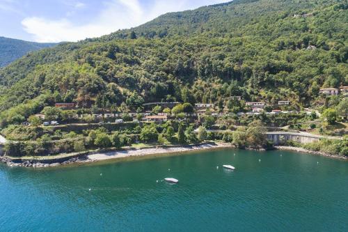 an aerial view of a small island in the water at Lakeview Cannobio Camping & Resort in Cannobio