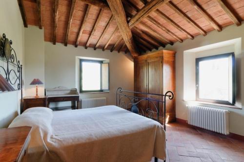 Postel nebo postele na pokoji v ubytování La Casaccia Guelfi