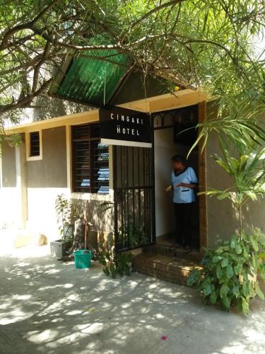 a man standing in the door of a hotel at Cingaki Hotel in Mombasa