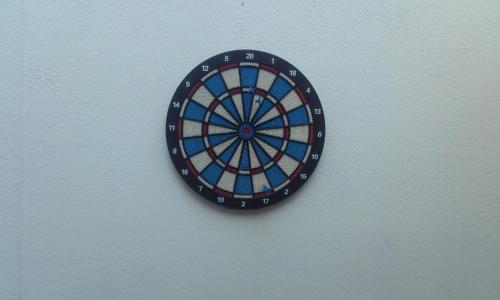 a dart board hanging on a wall at Les Casetes de Camarles in Camarles