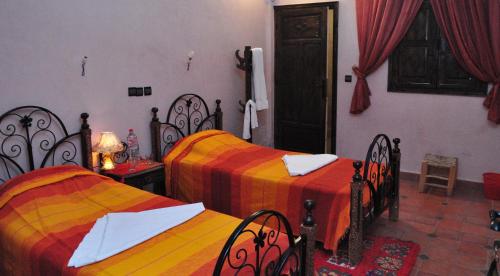 Postel nebo postele na pokoji v ubytování Hotel Soleil Imlil