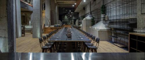 a long table with chairs in a large room at Hotel Warszawa in Warsaw