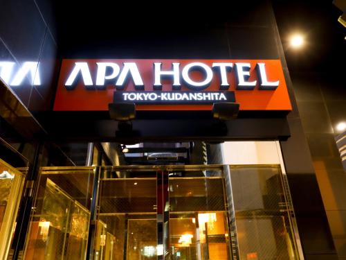 an apa hotel sign on the side of a building at APA Hotel Tokyo Kudanshita in Tokyo
