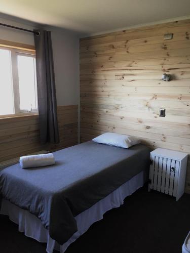 Postel nebo postele na pokoji v ubytování Refugio Pampa