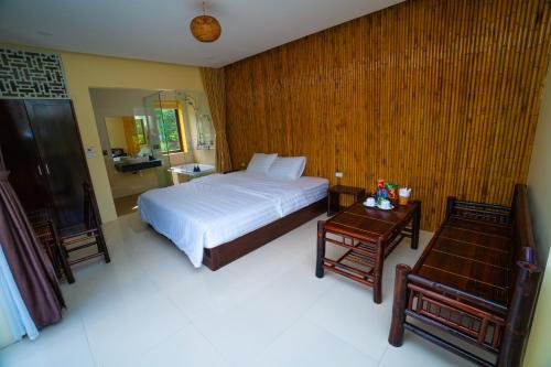 Trang An Retreat tesisinde bir odada yatak veya yataklar