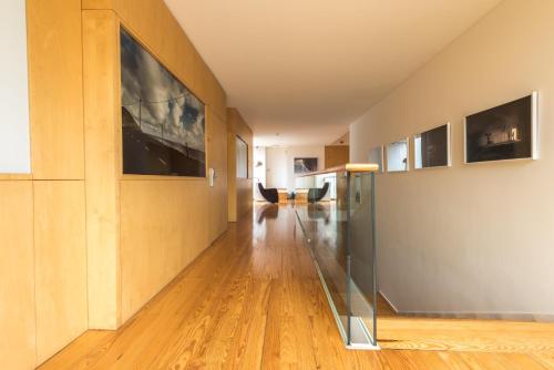 a hallway of a house with wooden floors at ARTS IN Hotel Conde Carvalhal in Funchal